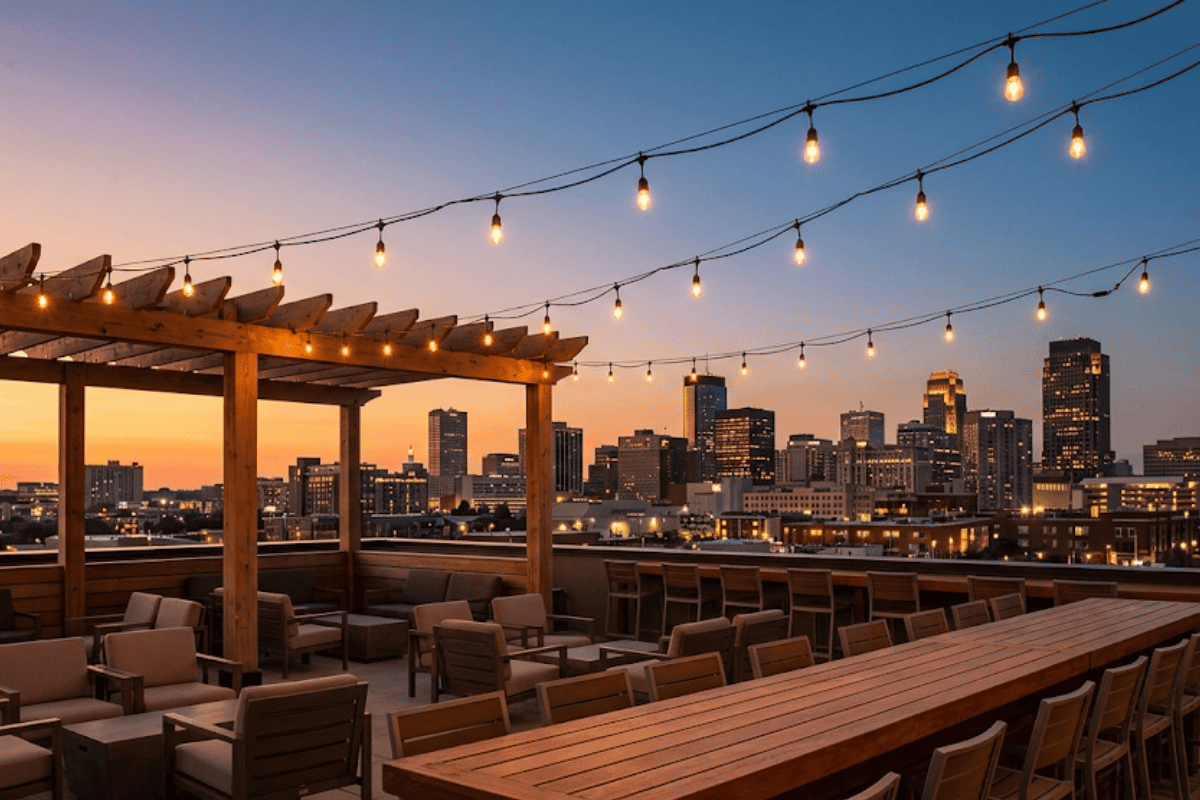 Rooftop bar patio with string lights and long tables set up for a private event in Tulsa